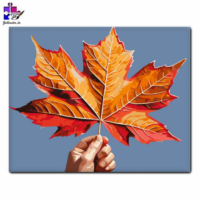 Herbstliche Ahornblätter in der Hand des Kindes | Malen nach Zahlen-Zahlmaler.de